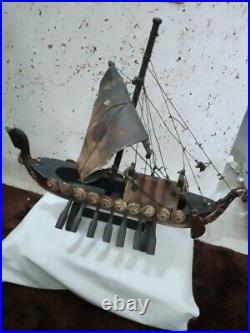 An old wooden ship made of old oak, 50 cm long and 45 cm high, from ancient time