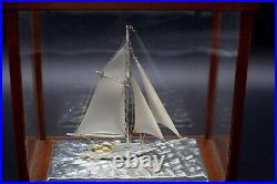 Hand crafted electroplated silver model of a sailing ship boat or yacht in case