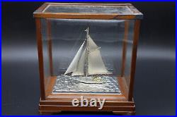 Hand crafted electroplated silver model of a sailing ship boat or yacht in case