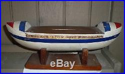 Marine folk art model of life saving boat- used as a bank for donations