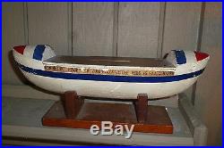Marine folk art model of life saving boat- used as a bank for donations